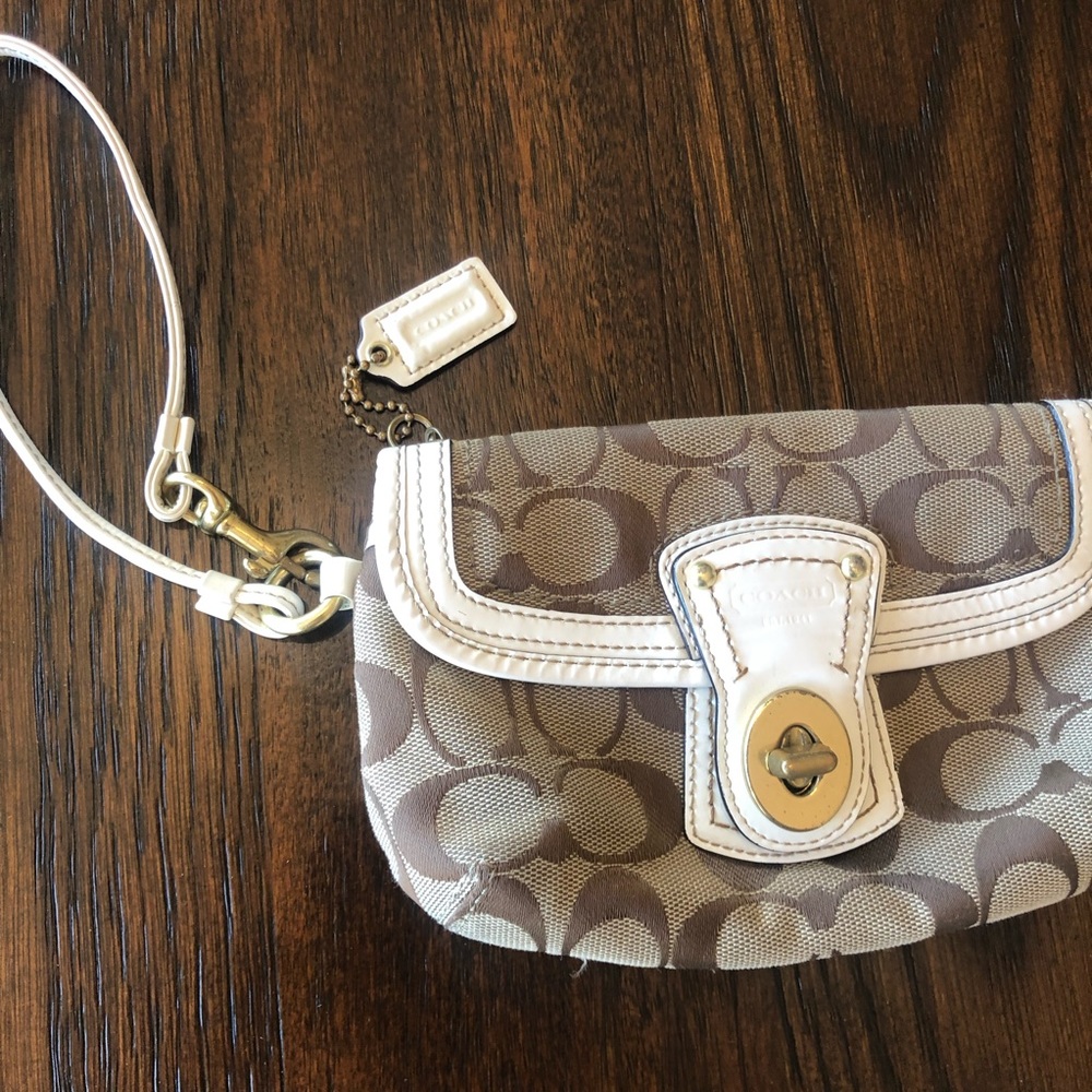 Coach wristlet with gold detail and zip pocket